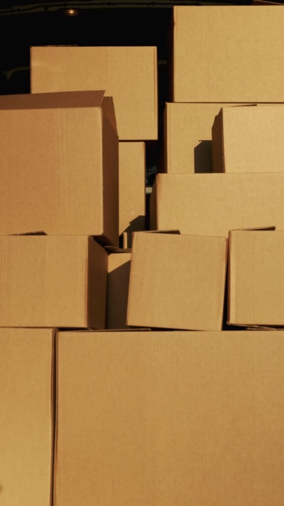 Stacked cardboard cartons prepared for transportation.
